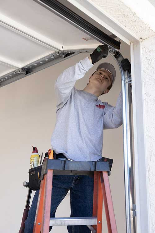 Garage Door Being Installed by Technician in Tempe